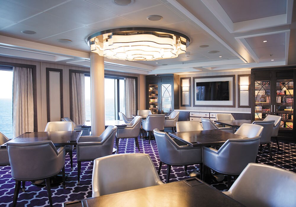 the card room aboard Seven Seas Splendor with leather seats and games